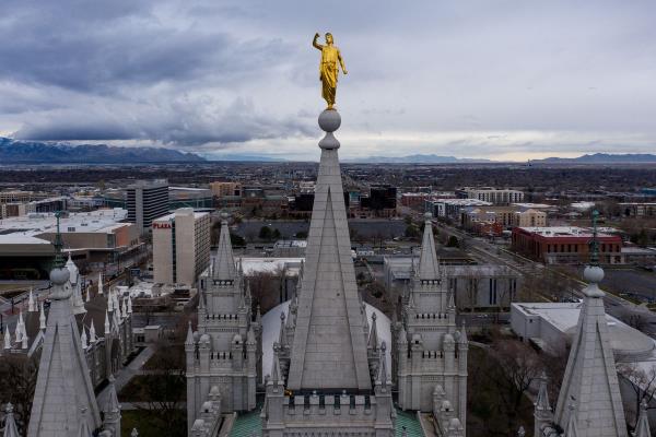 The Angel Moroni statue atop the Salt Lake Temple of The Church of Jesus Christ of Latter-day Saints stands with its trumpet missing after a 5.7 magnitude earthquake centered in Magna hit on Wednesday, March 18, 2020.