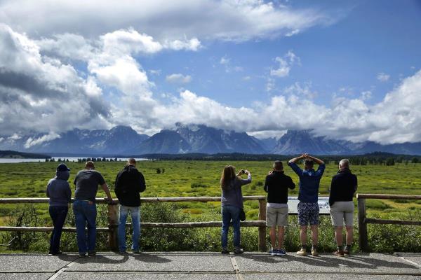 People look out at the Jackson Lake Lodge in Grand Teton Natio<em></em>nal Park.