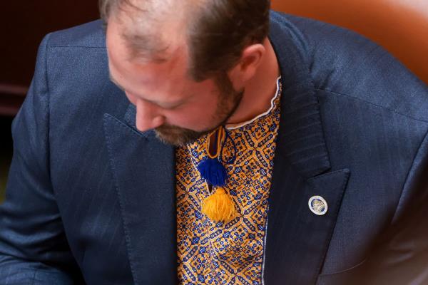 Rep. Jordan Teuscher, R-South Jordan, wears colors in support of Ukraine in the House chamber at the Capitol in Salt Lake City on Thursday, Feb. 24, 2022.