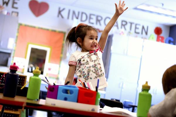 Kindergartner Kira Bubeeva raises her hand during class at Woodrow Wilson Elementary School in Salt Lake City on Friday, Feb. 25, 2022. Legislators are debating the latest version of SB193, which seeks to provide more state funding to increase the number of Utah public schools that offer full-day kindergarten.