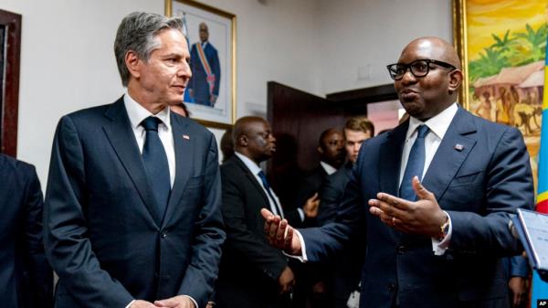 Democratic Republic of the Co<em></em>ngo Prime Minister Jean-Michel Sama Lukonde, right, speaks as he meets with Secretary of State Antony Bl<em></em>inken, left, at the Primature in Kinshasa, Congo, Wednesday, Aug. 10, 2022. 